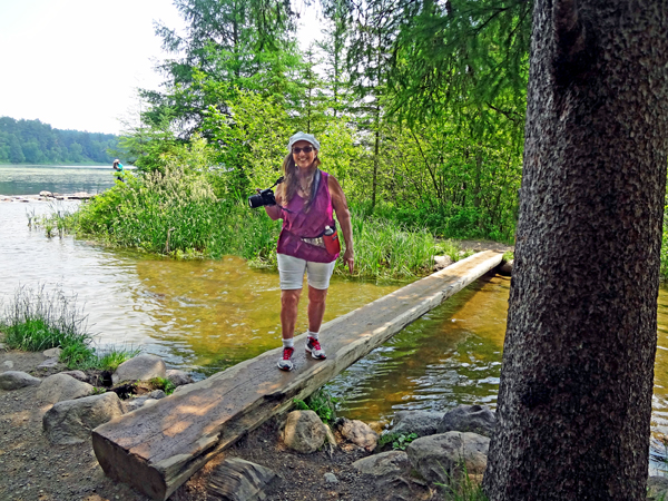 Karen Duquette on a bridge over the beginning of the Mississippi River